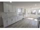 Renovated kitchen boasts white cabinets, stainless steel appliances, and ample countertop space at 4416 Inez Dr, Las Vegas, NV 89130