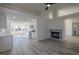 Open-concept living room featuring a modern fireplace and abundant natural light at 4416 Inez Dr, Las Vegas, NV 89130