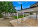 Inviting back patio featuring tiled flooring, a covered area, and a view of the well-maintained backyard and pool at 4430 Eureka Cir, Las Vegas, NV 89103