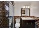 Updated bathroom features a toilet and vanity, plus decorative tiling and a glass shower stall at 4430 Eureka Cir, Las Vegas, NV 89103