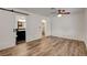 Spacious bedroom featuring wood floors, closet and doorway to the ensuite bathroom at 4430 Eureka Cir, Las Vegas, NV 89103