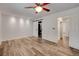 Bedroom with a ceiling fan, wood floors, and access to the bathroom and walk-in closet at 4430 Eureka Cir, Las Vegas, NV 89103