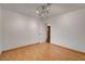 Empty bedroom featuring wood floors, modern lighting, and a closet with a door ajar at 4430 Eureka Cir, Las Vegas, NV 89103