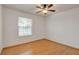 Cozy bedroom featuring hardwood floors, ceiling fan and bright natural light at 4430 Eureka Cir, Las Vegas, NV 89103