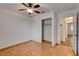 Bright bedroom with closet, hardwood floors and ceiling fan at 4430 Eureka Cir, Las Vegas, NV 89103