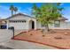 Attractive home showcasing desert landscaping, a two-car garage, and a welcoming entrance at 4430 Eureka Cir, Las Vegas, NV 89103