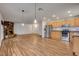 Spacious open concept kitchen with wood floors, stone fireplace and stainless steel appliances at 4430 Eureka Cir, Las Vegas, NV 89103