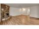 Bright living room with hardwood floors and a stone fireplace, perfect for entertaining at 4430 Eureka Cir, Las Vegas, NV 89103