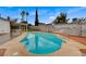 Inviting pool set in a private backyard with mature trees and privacy fencing, perfect for outdoor entertaining at 4430 Eureka Cir, Las Vegas, NV 89103