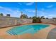 A classic pool design is enhanced with its cool blue water and surrounding patio in a private backyard at 4430 Eureka Cir, Las Vegas, NV 89103