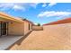 Backyard with gravel and concrete patio plus block wall for privacy and security at 4436 Hatch Bend Ave, North Las Vegas, NV 89031
