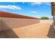 Gravel-filled backyard surrounded by block walls, offering privacy and low maintenance at 4436 Hatch Bend Ave, North Las Vegas, NV 89031