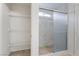 Bathroom featuring a combination shower and storage shelving at 4436 Hatch Bend Ave, North Las Vegas, NV 89031
