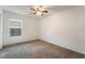 Bedroom features neutral carpet, ceiling fan and single window at 4436 Hatch Bend Ave, North Las Vegas, NV 89031