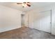 Neutral bedroom features a ceiling fan, neutral carpet, and a closet with sliding doors at 4436 Hatch Bend Ave, North Las Vegas, NV 89031