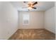 Bright bedroom with neutral carpet, ceiling fan and single window with shutter at 4436 Hatch Bend Ave, North Las Vegas, NV 89031