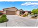 Attractive single-story home showcasing desert landscaping, expansive driveway, and an attached two car garage at 4436 Hatch Bend Ave, North Las Vegas, NV 89031