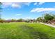 Large green community space with grassy area, walking path, and landscaping at 4436 Hatch Bend Ave, North Las Vegas, NV 89031