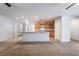Open concept kitchen with stainless steel appliances, light wood cabinetry, and a breakfast bar at 4436 Hatch Bend Ave, North Las Vegas, NV 89031