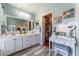 A spacious bathroom featuring dual sinks, vanity and walk-in closet at 4515 Sandstone Vista Ct, North Las Vegas, NV 89031