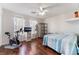 A spacious bedroom featuring wood floors and ceiling fan at 4515 Sandstone Vista Ct, North Las Vegas, NV 89031