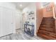 Entryway featuring a console table with decorative items and a staircase with wood steps at 4515 Sandstone Vista Ct, North Las Vegas, NV 89031