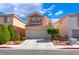Inviting two-story home featuring a two-car garage and manicured landscaping at 4515 Sandstone Vista Ct, North Las Vegas, NV 89031