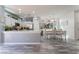 Bright open concept kitchen and dining area with modern stainless steel appliances at 4515 Sandstone Vista Ct, North Las Vegas, NV 89031