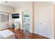 Bright main bedroom featuring hardwood floors and a bathroom that includes a large tub at 4515 Sandstone Vista Ct, North Las Vegas, NV 89031