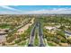Aerial view of a well-manicured Siena neighborhood featuring tree-lined streets and lush landscaping at 4980 Pensier St, Las Vegas, NV 89135