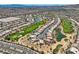 Community view with residential homes along a golf course and lake at 4980 Pensier St, Las Vegas, NV 89135