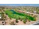 Scenic aerial view of the lush golf course and serene lake within the Siena community at 4980 Pensier St, Las Vegas, NV 89135