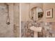 Bathroom with a walk-in shower and a decorative backsplash and sink at 4980 Pensier St, Las Vegas, NV 89135