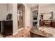 Bathroom featuring a soaking tub, a walk-in shower, dual sinks, and decorative tiled floors at 4980 Pensier St, Las Vegas, NV 89135