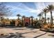 Exterior of the clubhouse with lush landscaping, mature trees, and palm trees at 4980 Pensier St, Las Vegas, NV 89135