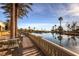 Tables and chairs overlooking calm lake at community center at 4980 Pensier St, Las Vegas, NV 89135