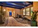 Charming courtyard with brick flooring, garden decor, and comfortable seating at 4980 Pensier St, Las Vegas, NV 89135