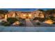 Charming single-story home featuring a desert-landscaped front yard, an arched entryway and an attached two-car garage at 4980 Pensier St, Las Vegas, NV 89135