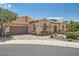 Beautiful one-story home featuring desert landscaping, a paved driveway, and a two-car garage at 4980 Pensier St, Las Vegas, NV 89135