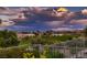 Stunning views of the golf course and mountains with luxury homes and colorful sky at 4980 Pensier St, Las Vegas, NV 89135