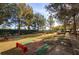 Horseshoe pit area with meticulous landscaping and mature shade trees at 4980 Pensier St, Las Vegas, NV 89135
