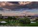 Picturesque landscape with lush greenery, mature trees, and views of the surrounding neighborhood at 4980 Pensier St, Las Vegas, NV 89135