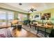 Elegant living room boasts a baby grand piano, hardwood floors, and a beautiful view at 4980 Pensier St, Las Vegas, NV 89135