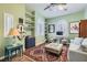 Inviting living room with hardwood floors, built-in shelving, and a sitting area at 4980 Pensier St, Las Vegas, NV 89135