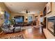 Comfortable living room features hardwood floors, plenty of windows for natural light, and stylish furniture at 4980 Pensier St, Las Vegas, NV 89135