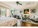 Bright main bedroom with hardwood floors, natural light, and a door to the patio at 4980 Pensier St, Las Vegas, NV 89135
