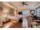 Elegant main bedroom features a tray ceiling, a desk, french doors to the patio, and hardwood floors at 4980 Pensier St, Las Vegas, NV 89135