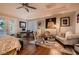 Spacious and elegant main bedroom with a sitting area, desk, and french doors to the patio at 4980 Pensier St, Las Vegas, NV 89135