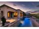 Inviting backyard pool and hot tub, perfect for relaxation and entertaining, especially at twilight at 4980 Pensier St, Las Vegas, NV 89135
