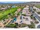 Aerial view of property featuring a pool, spa and solar panels at 4980 Pensier St, Las Vegas, NV 89135